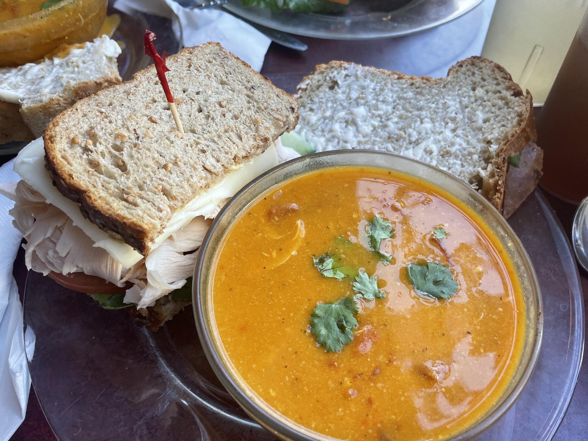 A bowl of soup and sandwich.